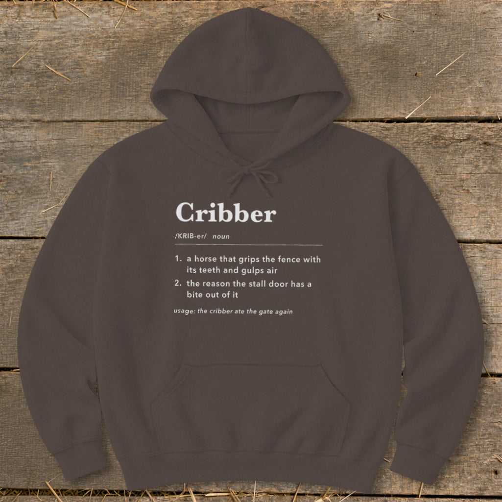 Dark brown hoodie with white dictionary definition text for Cribber printed on the chest.
