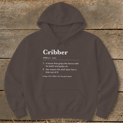 Dark brown hoodie with white dictionary definition text for Cribber printed on the chest.