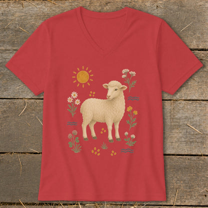 Red v-neck t-shirt with a cream sheep illustration and surrounding flowers and sun.