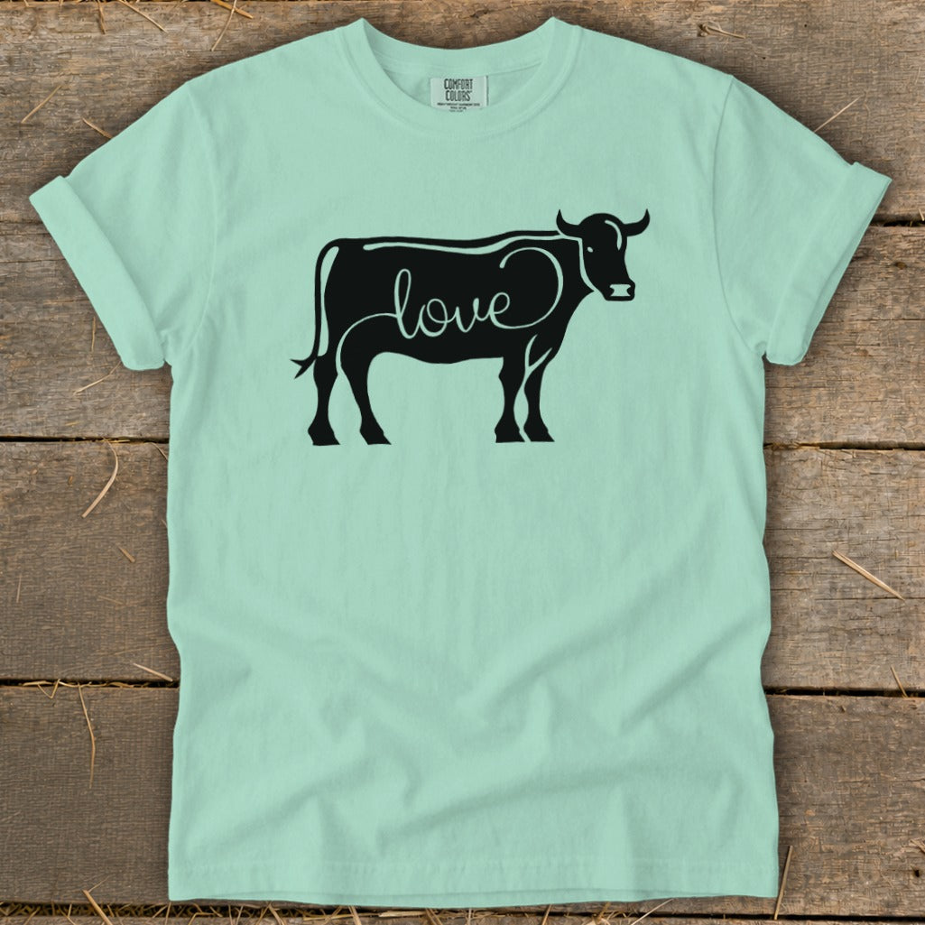 Black silhouette of a cow with the word "love" written in cursive on its body.