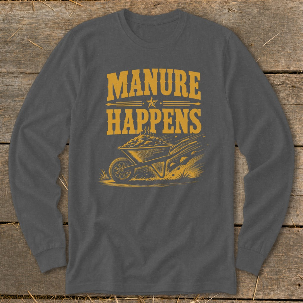 Graphic tee with text "MANURE HAPPENS" and a wheelbarrow overflowing with manure.