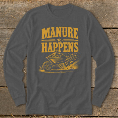 Graphic tee with text "MANURE HAPPENS" and a wheelbarrow overflowing with manure.