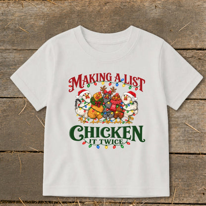 White t-shirt with "Making A List Chicken It Twice" text and festive chickens.