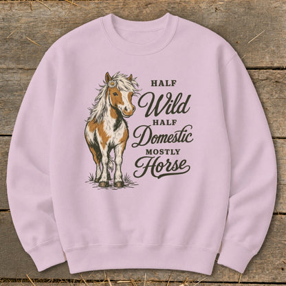 Pink sweatshirt with graphic of a horse and text "Half Wild, Half Domestic, Mostly Horse".