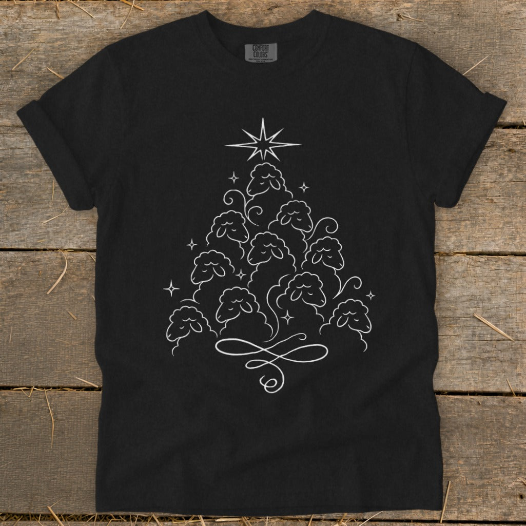 Black t-shirt with white line art of a Christmas tree made of sheep and stars.