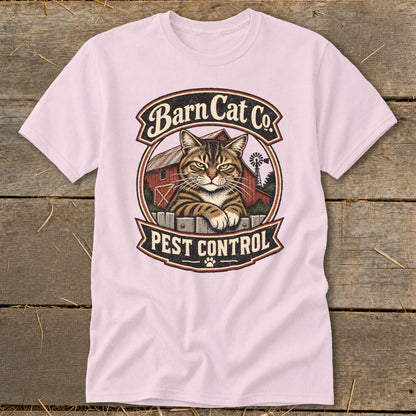 Light pink short-sleeve t-shirt featuring a vintage Barn Cat Co. Pest Control graphic centered on the chest.