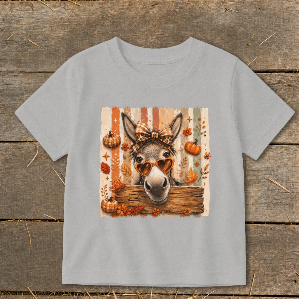Donkey wearing heart sunglasses and plaid bow on a fall-themed graphic.