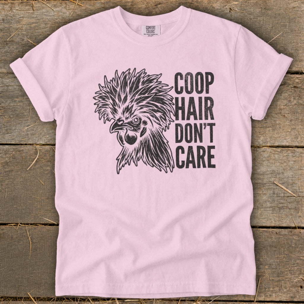 Pink t-shirt with a black graphic of a rooster and the text "COOP HAIR DON'T CARE."