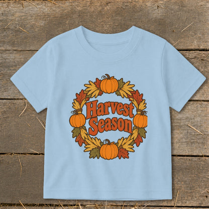 Light blue t-shirt with a "Harvest Season" graphic featuring pumpkins and autumn leaves.