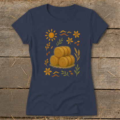 Navy t-shirt with a scattered farm-themed print featuring hay bales, sun, flowers, and wheat.