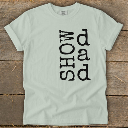Light green t-shirt with black text reading "SHOW" and "dad".