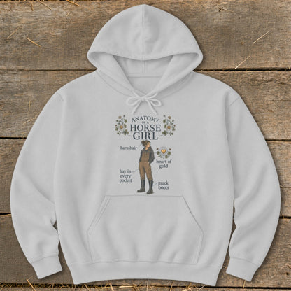 White hoodie with "Anatomy of a Horse Girl" graphic featuring labeled horse girl illustration.