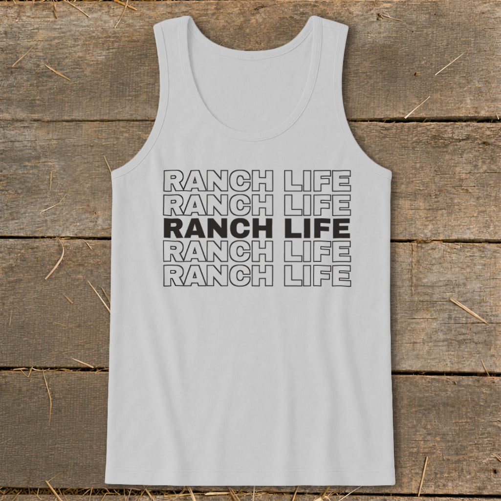 A light gray tank top with the text Ranch Life repeated in stacked lines against a wooden surface.