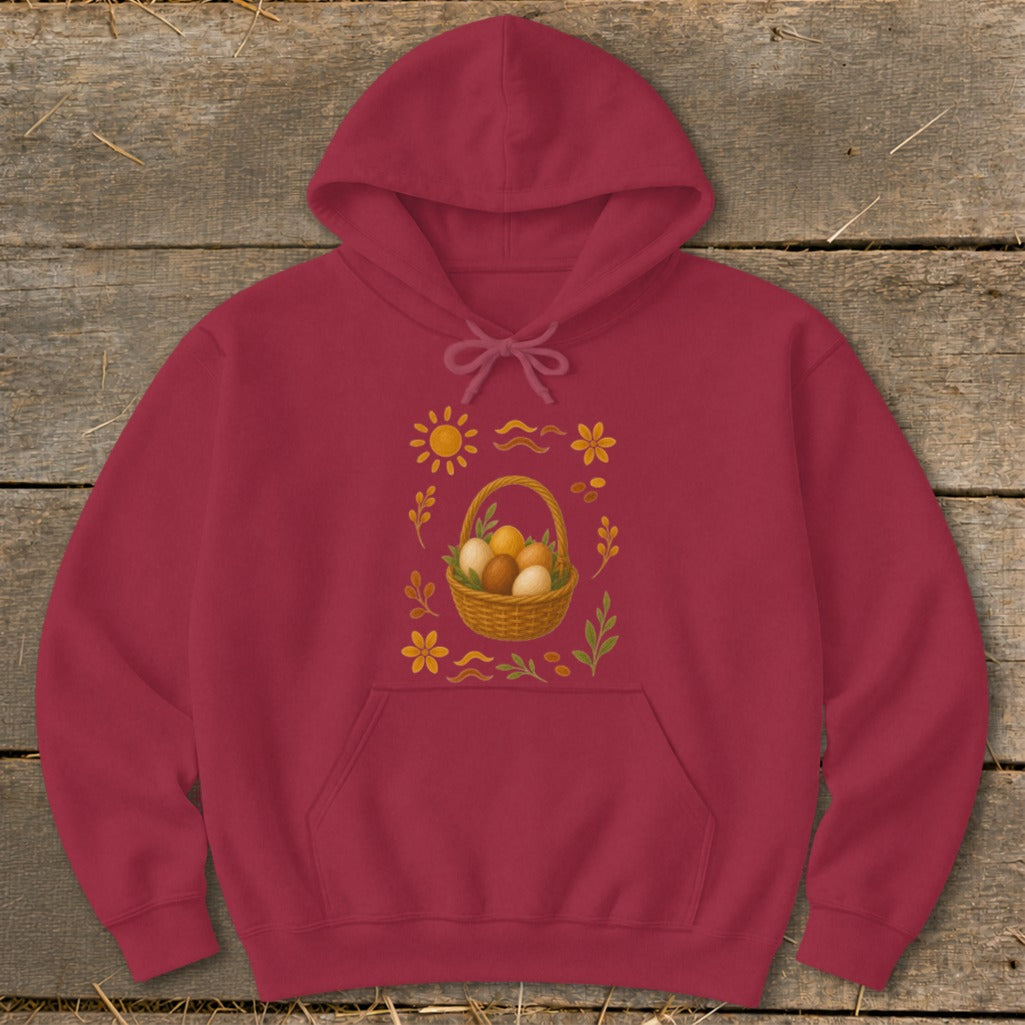 Maroon hoodie with a woven basket of Easter eggs and decorative sun and flowers.