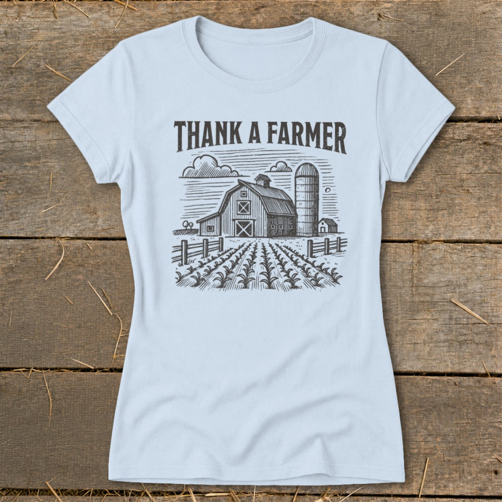 Light blue t-shirt with "THANK A FARMER" text and barn, silo, and field graphic.