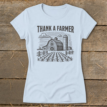 Light blue t-shirt with "THANK A FARMER" text and barn, silo, and field graphic.