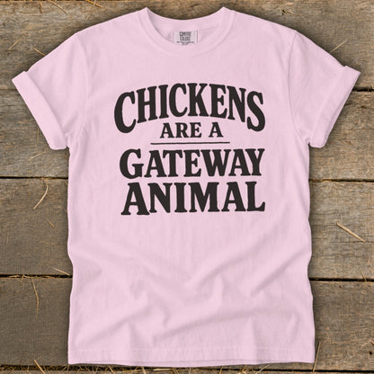 Pink t-shirt with black text reading "CHICKENS ARE A GATEWAY ANIMAL"