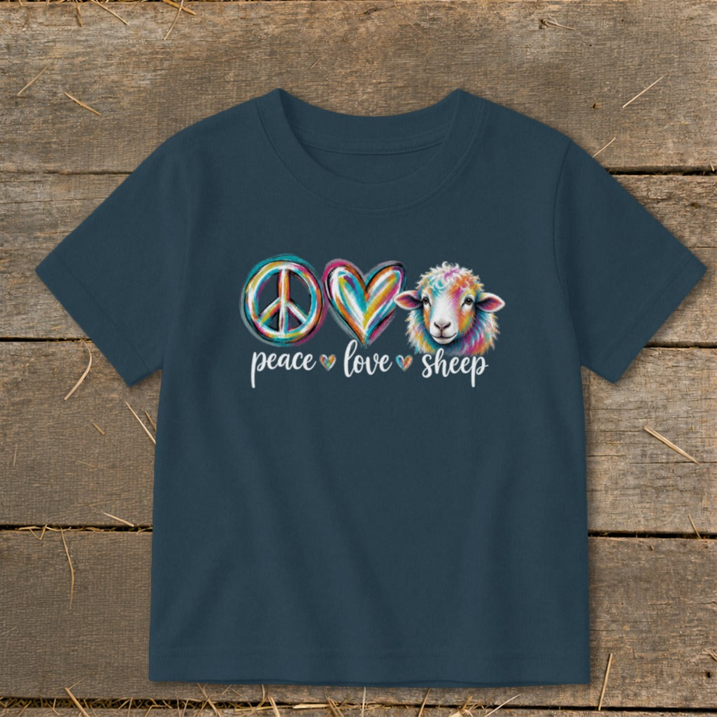 Dark blue t-shirt with peace, heart, and colorful sheep graphic and text.