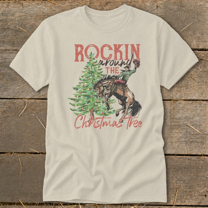 T-shirt graphic: "Rockin' Around The Christmas Tree" with cowboy on bucking horse.