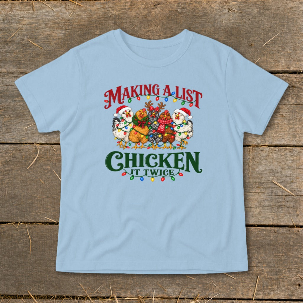 Light blue t-shirt with chickens wearing Santa hats and Christmas lights, text reads "Making a List, Chicken It Twice".