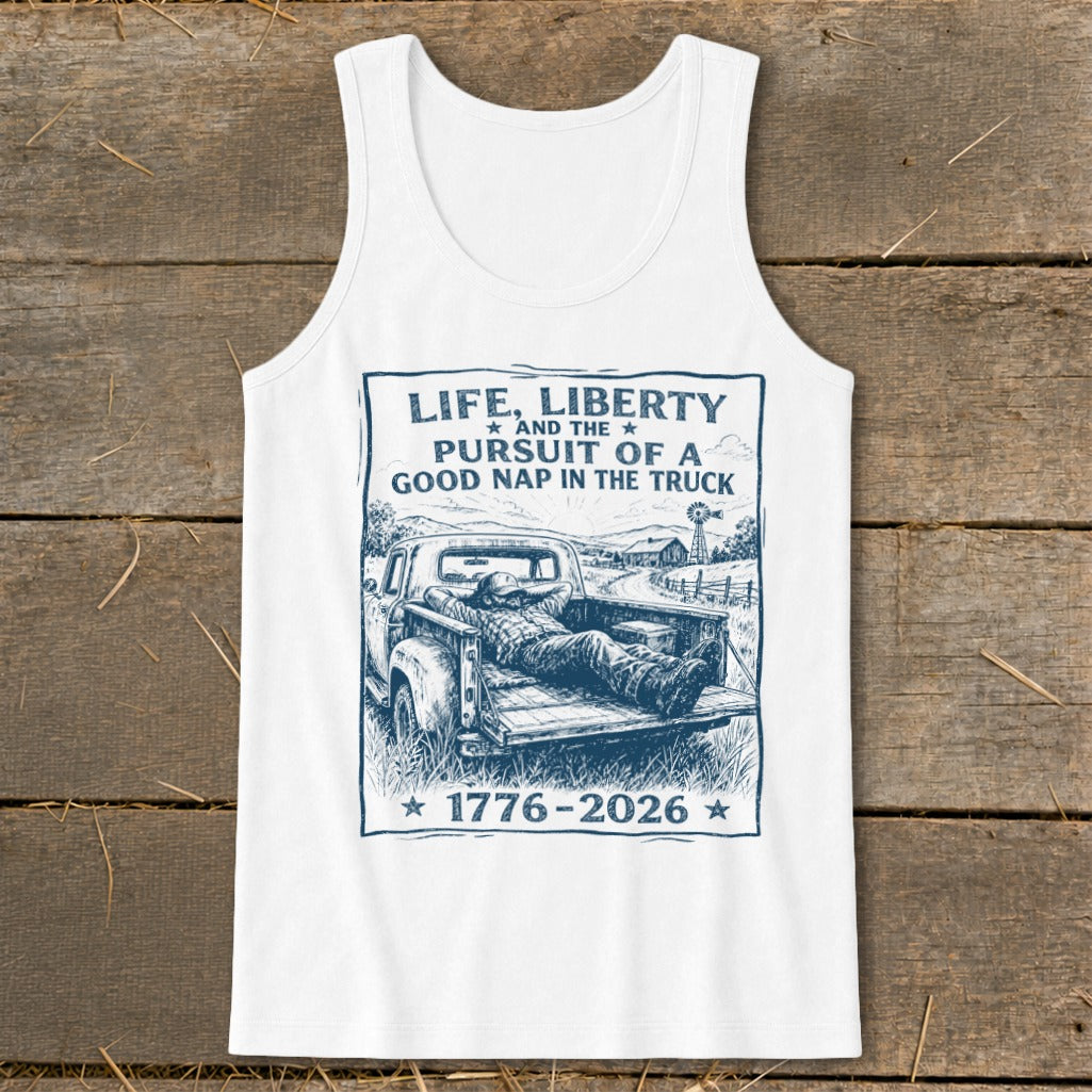 White tank top with "Life, Liberty, and the Pursuit of a Good Nap in the Truck 1776-2026" text.