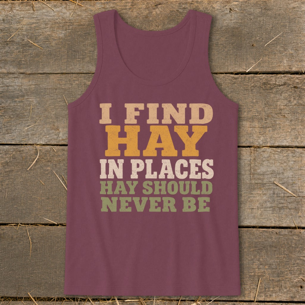 Maroon tank top with text: I FIND HAY IN PLACES HAY SHOULD NEVER BE