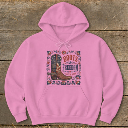 Pink hoodie with "Boots & Freedom Since 1776" graphic and cowboy boot.