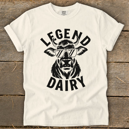 Cream t-shirt with black graphic of a cow wearing sunglasses and text "LEGEND DAIRY".