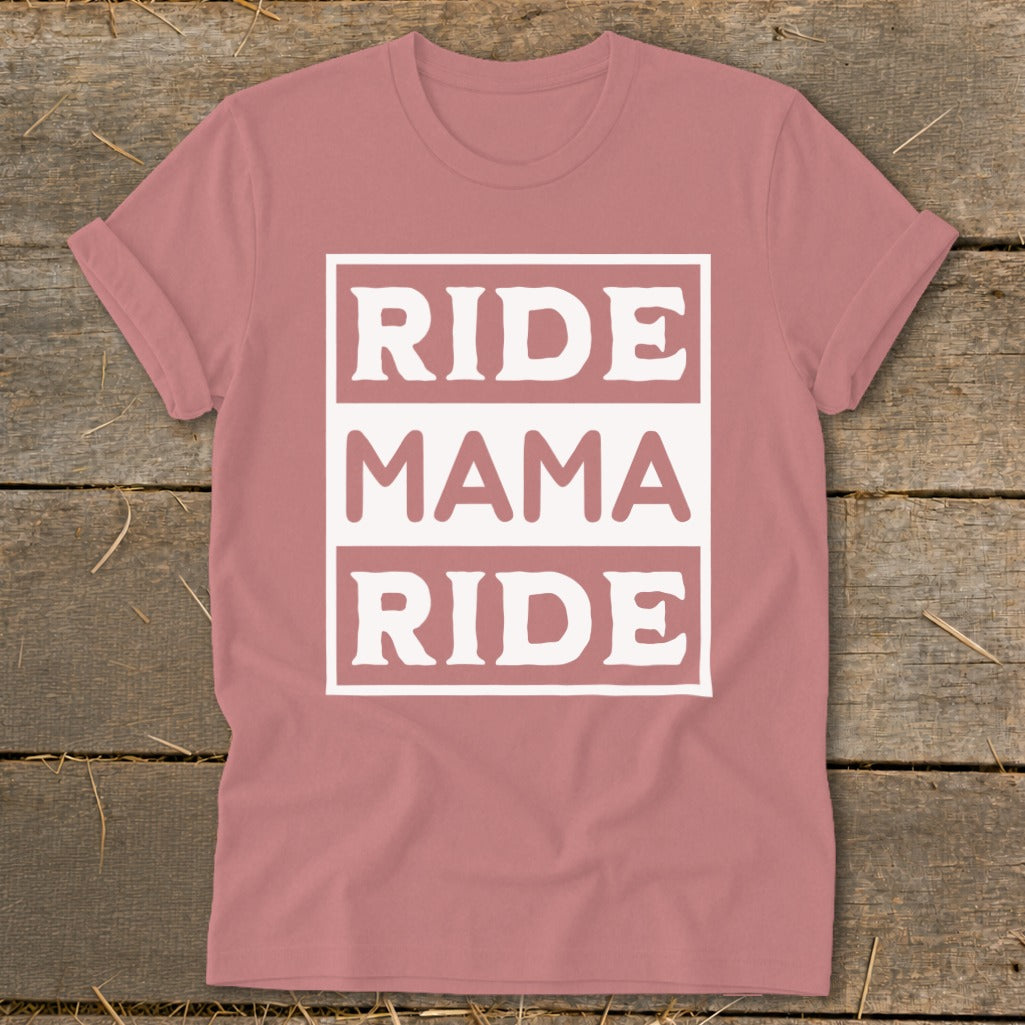 Pink t-shirt with white text reading "RIDE MAMA RIDE" in stacked blocks.