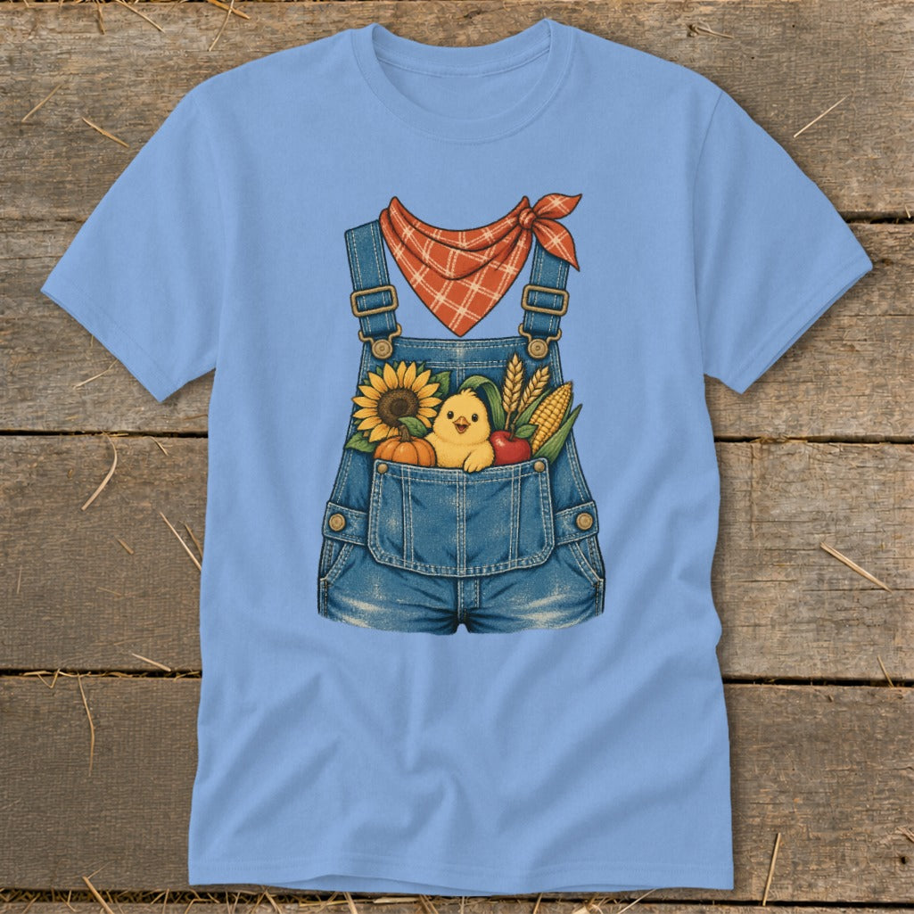 Light blue t-shirt with denim overalls graphic featuring a chick, sunflower, pumpkin, corn, and apple.