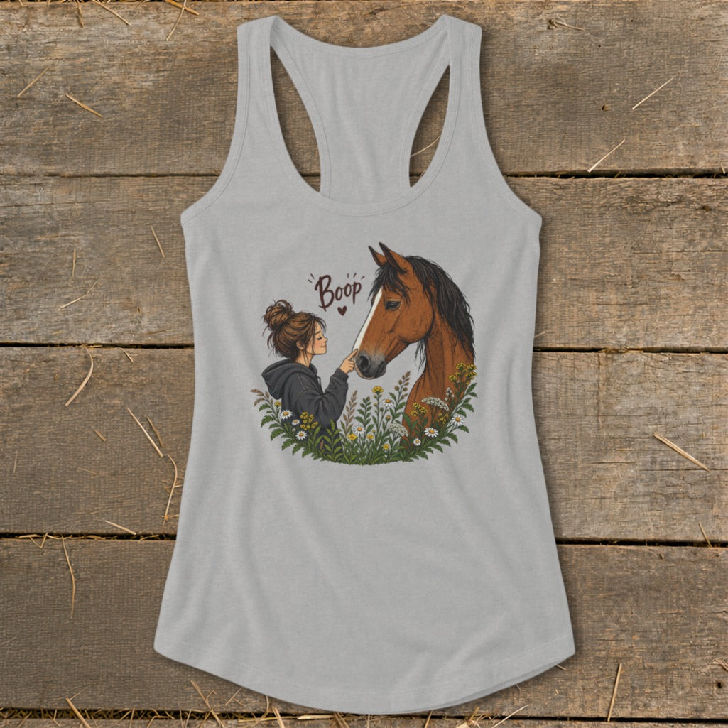 Girl with bun booping a brown horse's nose, text "Boop".