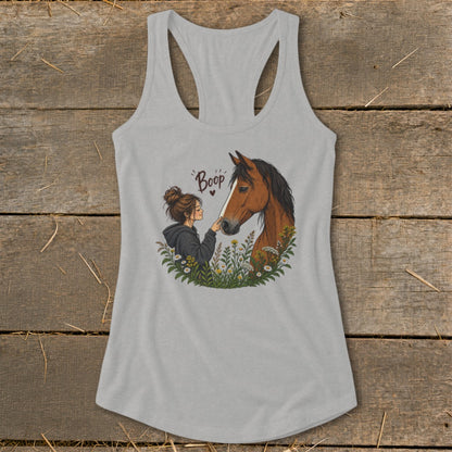 Girl with bun booping a brown horse's nose, text "Boop".