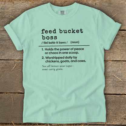 Light mint green t-shirt with "feed bucket boss" definition and farming humor text.