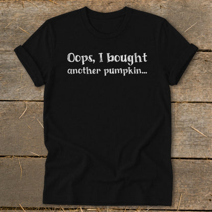 Black t-shirt with white text "Oops, I bought another pumpkin..."