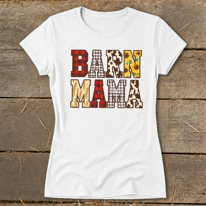 White t-shirt with "BARN MAMA" text featuring plaid, cow print, sunflowers, and wheat patterns.