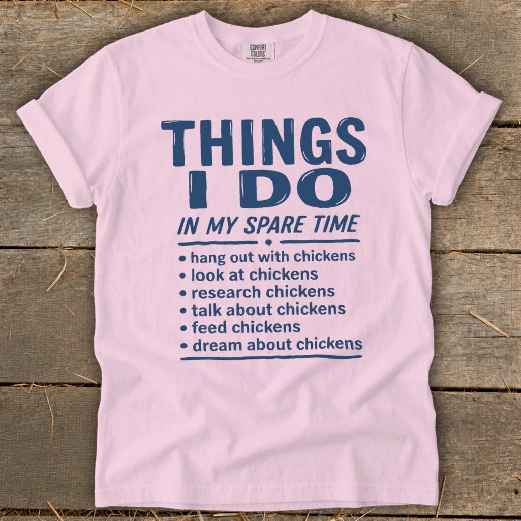 Pink t-shirt with "Things I Do In My Spare Time" and chicken-related activities.