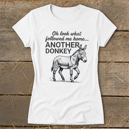 White t-shirt with "Oh look what followed me home... ANOTHER DONKEY" and a donkey drawing.