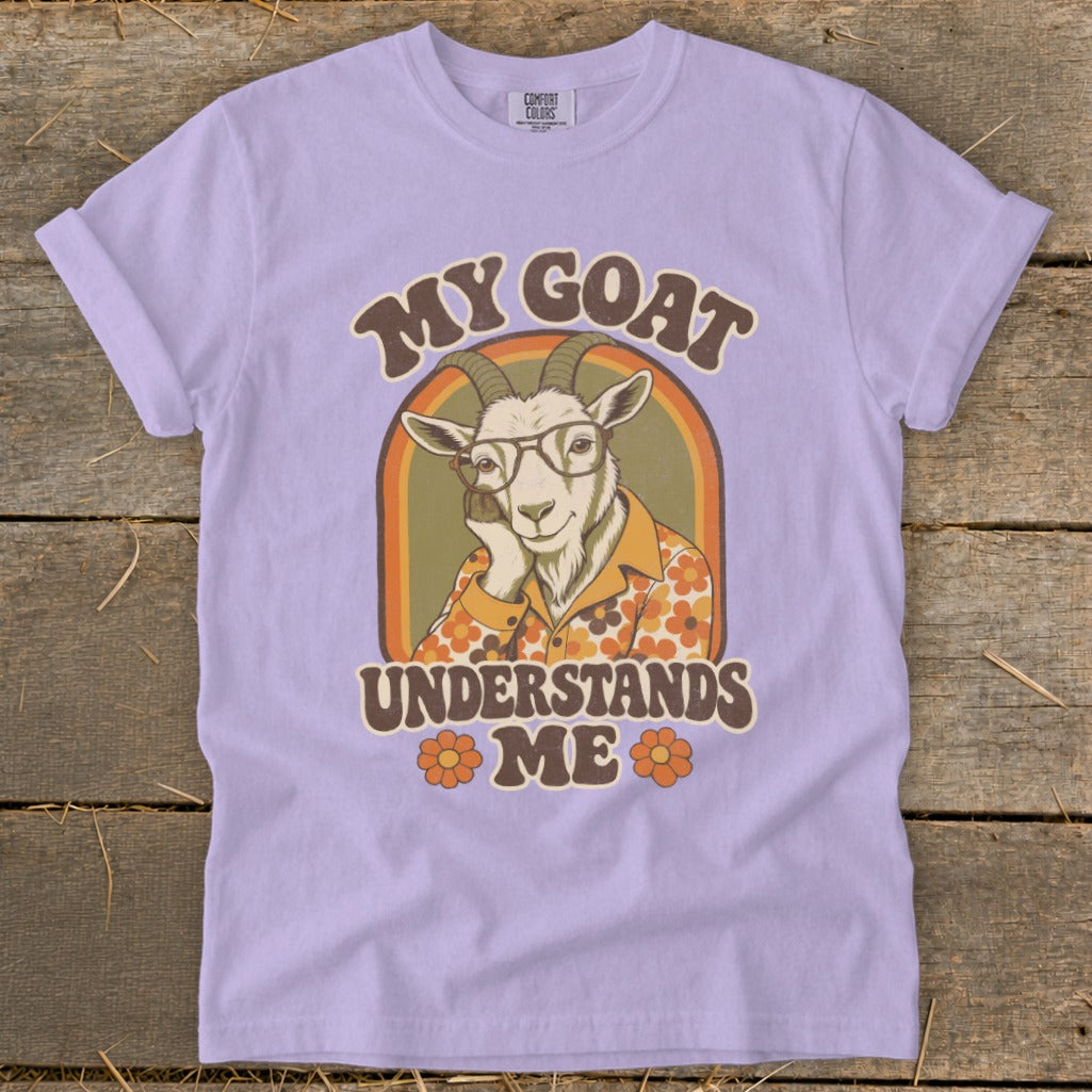 Lilac t-shirt with a retro graphic of a goat wearing glasses and the text "MY GOAT UNDERSTANDS ME".