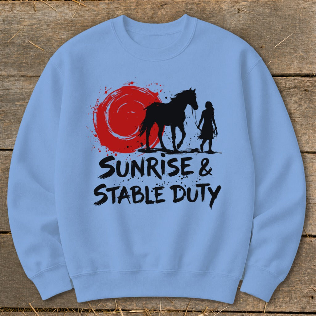 Light blue sweatshirt with black graphic of horse, rider, red sun, and text.
