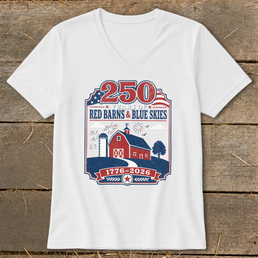 White v-neck t-shirt with "250 Years of Red Barns & Blue Skies" and "1776-2026" patriotic graphic.