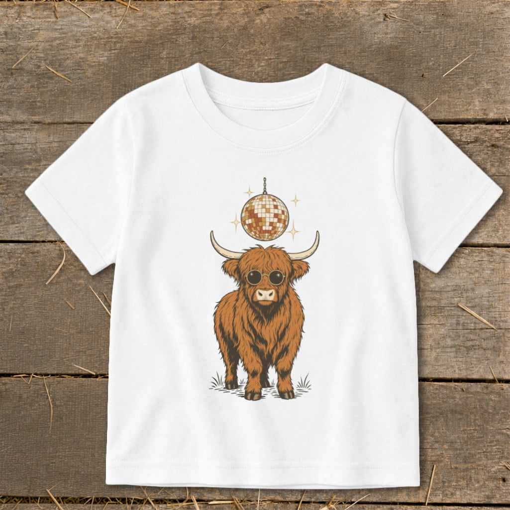 Highland cow wearing sunglasses with a disco ball above.