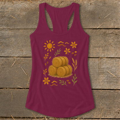 Maroon tank top with a harvest-themed print featuring hay bales, sun, and flowers.