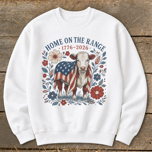 Cow wearing American flag blanket with "Home on the Range 1776-2026" text.