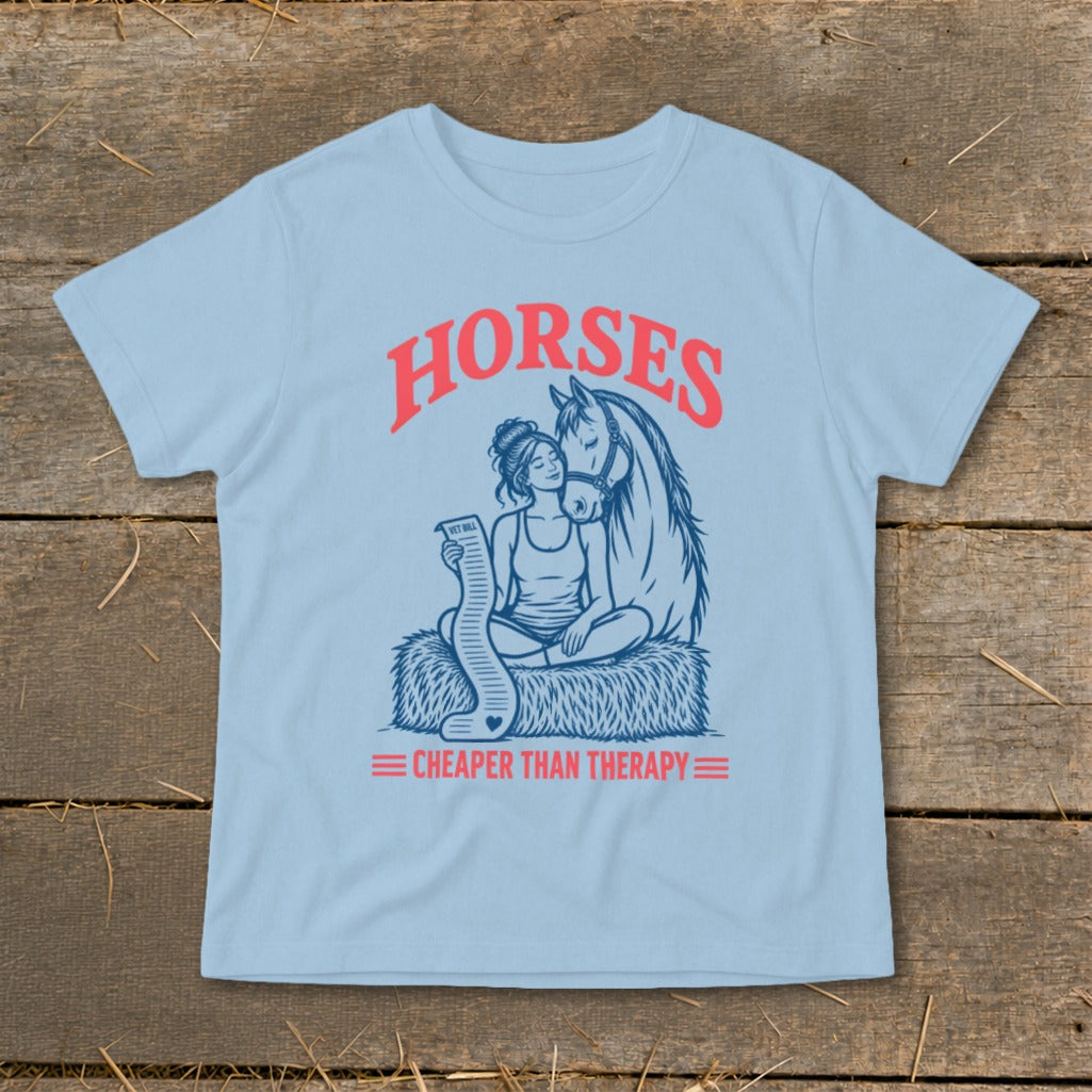 Light blue t-shirt with "HORSES" and "CHEAPER THAN THERAPY" text and a horse and rider illustration.