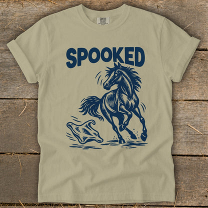 T-shirt with dark blue graphic of a startled horse running from a ghost with "SPOOKED" text.