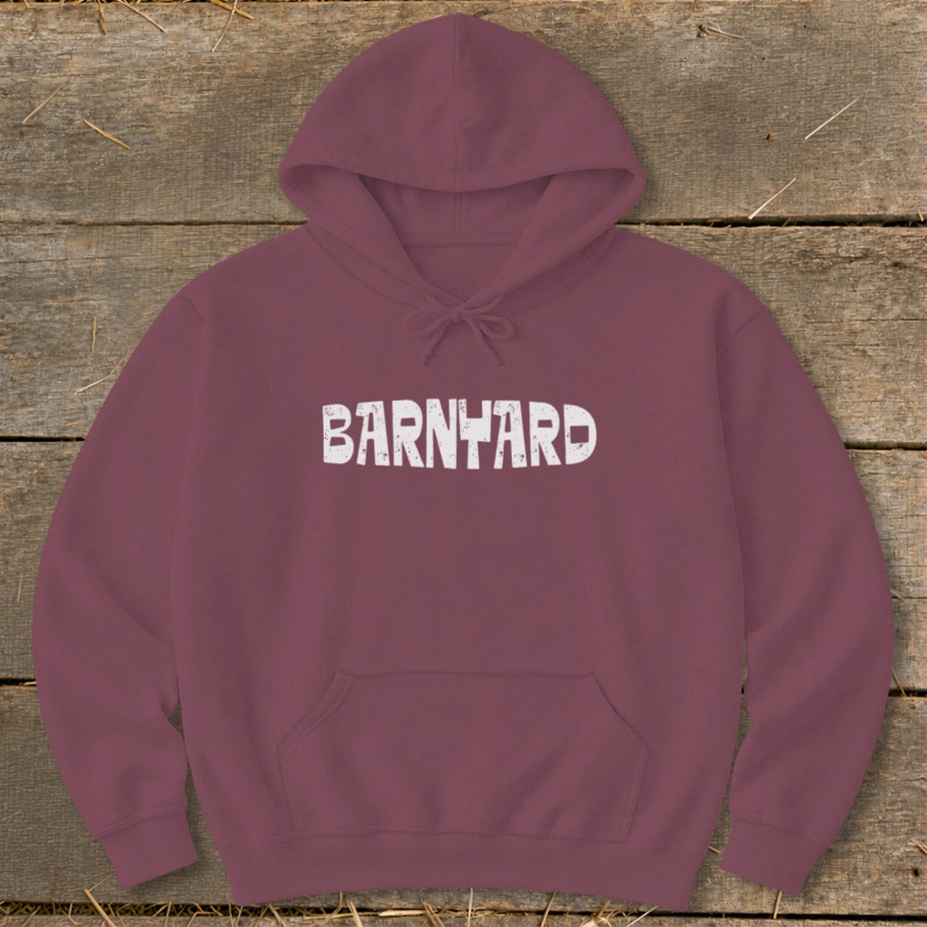 A maroon hooded sweatshirt with a front pocket, featuring white distressed text reading BARNYARD across the chest.
