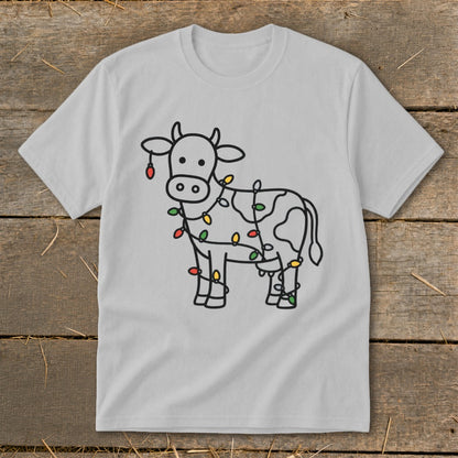 Gray t-shirt with a line drawing of a cow wrapped in colorful Christmas lights.