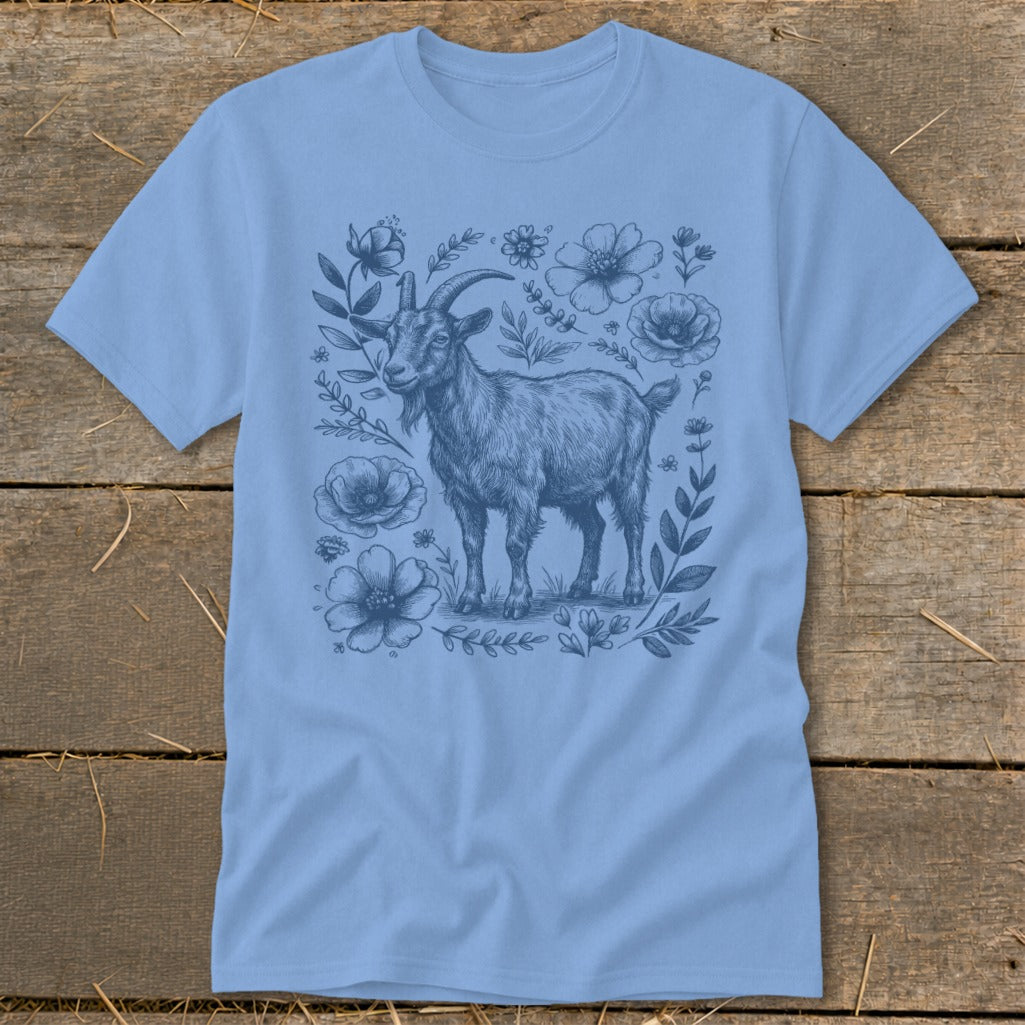 Light blue t-shirt with a sketch of a goat surrounded by flowers.