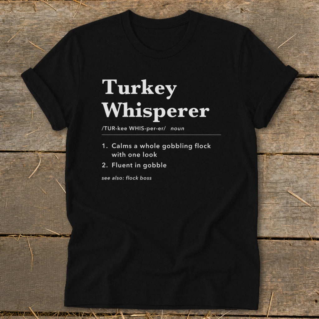 Black t-shirt with "Turkey Whisperer" definition and humor.