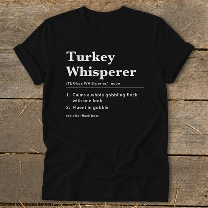 Black t-shirt with "Turkey Whisperer" definition and humor.
